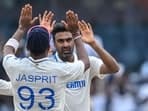 India's Ravichandran Ashwin (R) celebrates with his teammate Jasprit Bumrah