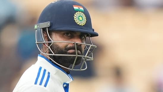 Virat Kohli reacts as he leaves the field after losing his wicket on the second day of the first cricket test match between India and Bangladesh