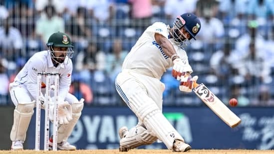 India's Rishabh Pant (R) plays a shot against Bangladesh