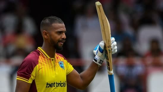 Nicholas Pooran celebrates his half century during the 2nd T20I between West Indies and India at Guyana National Stadium in Providence, Guyana