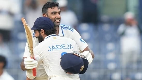 India's Ravichandran Ashwin celebrates after scoring a century with Ravindra Jadeja.