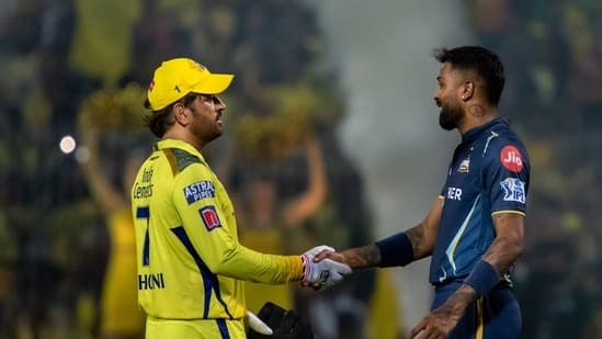 Chennai Super Kings' captain MS Dhoni, left, shakes hands with Gujrat Titans' captain Hardik Pandya after Chennai Super Kings won the Indian Premier League qualifier cricket match against Gujrat Titans in Chennai, India, Tuesday, May 23, 2023. (AP Photo /R. Parthibhan)