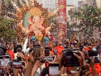 In Nagpur, devotees participated in a procession carrying a Lord Ganesha idol to a pandal on the eve of Ganesh Chaturthi.(PTI)