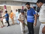 Applicants are inspected by a police person before entering the exam centre to appear for the Civil Services (Main) Examination in Patna. (Santosh Kumar )