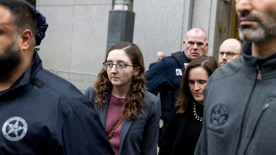 Caroline Ellison, former chief executive officer of Alameda Research LLC, center, exits court in New York, US.